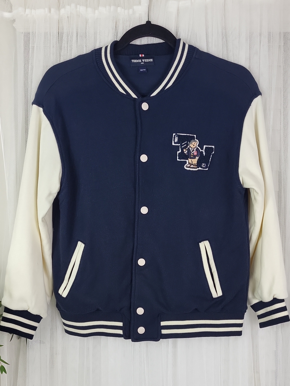 Teenie Weenie Kids Navy and Cream Varsity Jacket with Bear Patch. Size L